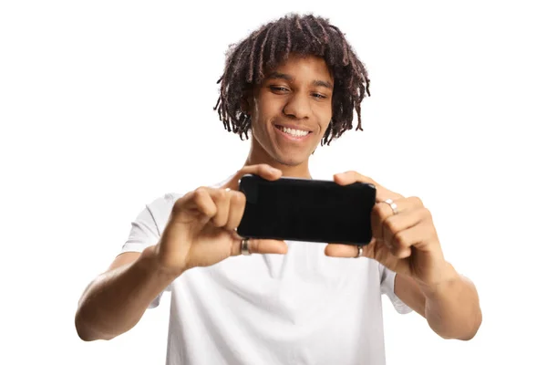 African American Young Man Taking Photo Smartphone Smiling Isolated White — Stock fotografie