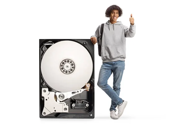 African American Male Student Leaning Big Hard Disk Gesturing Thumbs — Fotografia de Stock