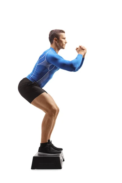 Full Length Portrait Male Step Aerobic Instructor Showing Exercise Isolated — Stockfoto
