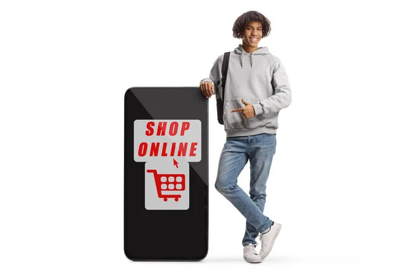 Young African American Male Backpack Pointing Big Mobile Phone Text — Stock fotografie