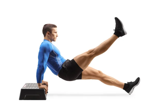 Full Length Profile Shot Muscular Man Exercising Planks Stepper Isolated — Stockfoto
