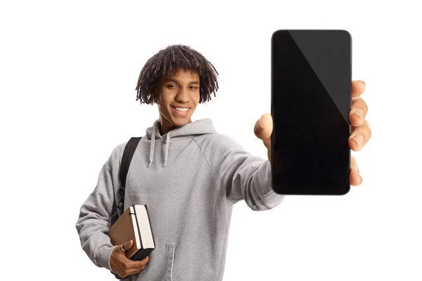 Young African American Male Student Holding Books Showing Mobile Phone — Stock Photo, Image