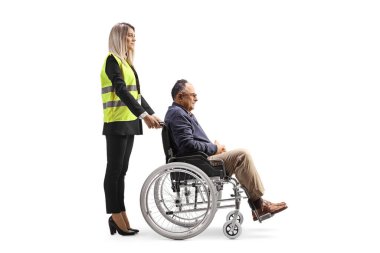 Female special assitance worker standing with a marture man in a wheelchair isolated on white background