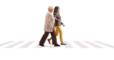 Young and elderly woman walking on a pedestiran crossing isolated on white background