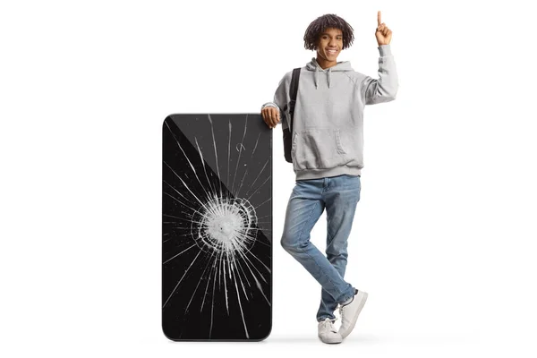 Young African American Man Big Mobile Phone Cracked Screen Pointing — Photo
