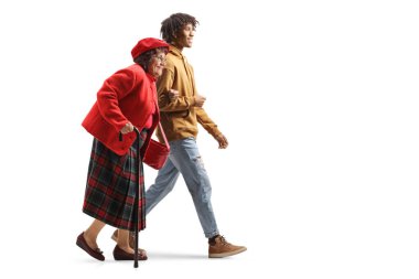 Young african american man holding a caucasian senior woman under arm and walking isolated on white background