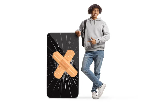 Young African American Man Pointing Big Mobile Phone Cracked Screen — Photo