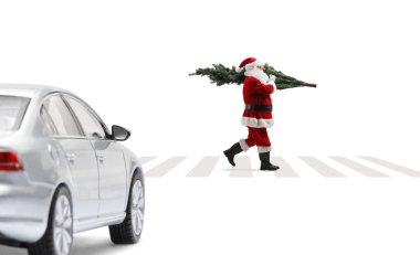 Car waiting for santa claus to cross a street on a pedestrian crossing isolated on white background