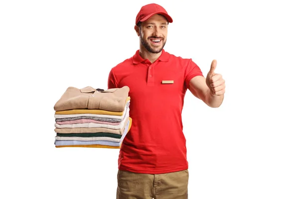 Laundry Worker Holding Pile Folded Clothes Gesturing Thumbs Isolated White — Photo