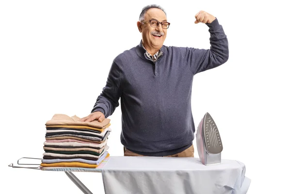 Mature Man Pile Folder Clothes Ironing Board Showing Muscles Isolated — Stock fotografie