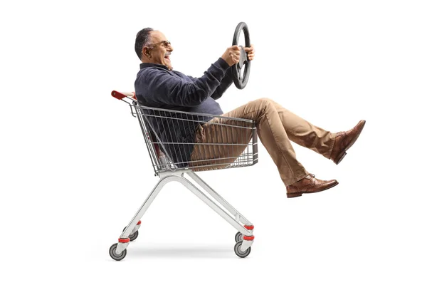Funny Mature Man Shopping Cart Holding Steering Wheel Isolated White — Stockfoto