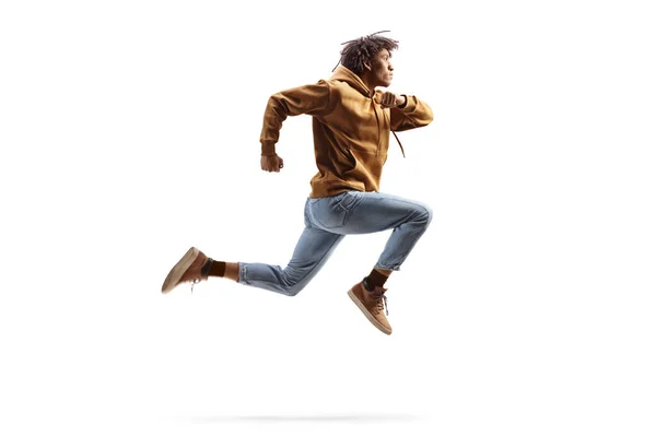 Imagen Perfil Completo Joven Afroamericano Saltando Aislado Sobre Fondo Blanco —  Fotos de Stock