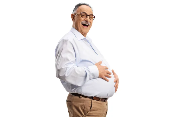 一个成熟的男人抱着他的大肚子 在白色的背景下孤独地笑着 — 图库照片