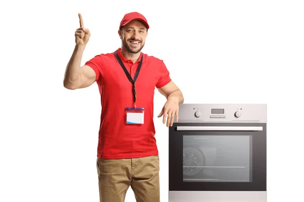 Salesman Leaning Oven Pointing Isolated White Background — Stock Photo, Image