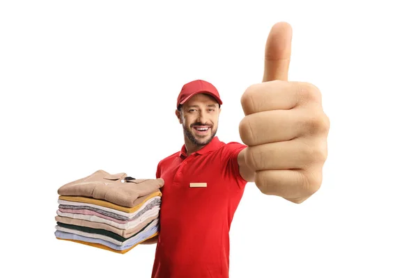 Laundry Worker Holding Pile Clothes Gesturing Thumbs Isolated White Background — Stock Photo, Image