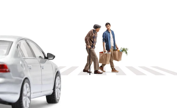 Young Man Helping Senior Grocery Bags Pedestrian Crossing Car Waiting — Stock Photo, Image