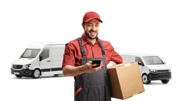 Male Logistic Worker Typing Mobile Phone Holding Cardboard Box Front — Stock Photo, Image
