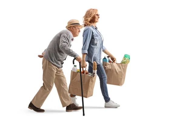 Full Length Profile Shot Elderly Man Walking Cane Woman Carrying — Stock Photo, Image