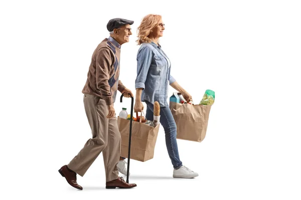 Foto Perfil Completo Anciano Caminando Con Bastón Una Mujer Llevando — Foto de Stock
