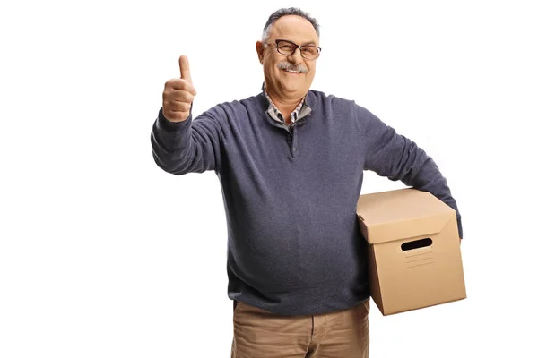 Happy Mature Man Holding Cardboard Box Gesturing Thumbs Isolated White — Stock Photo, Image