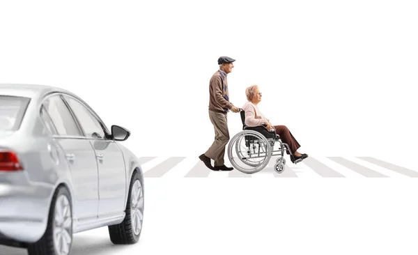 Full Length Profile Shot Elderly Man Pushing Elderly Woman Wheelchair — Stock Photo, Image