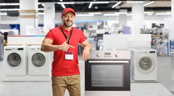 Salesman Electrical Appliances Smiling Pointing Oven Store — Stock Photo, Image