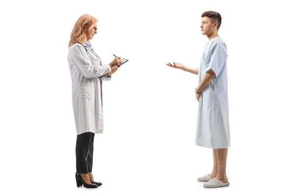 Full Length Profile Shot Female Doctor Talking Young Hospitalized Male — Stock Photo, Image