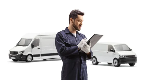 Auto Mechanic Worker Writing Document Front Two White Vans Isolated — Stock Photo, Image