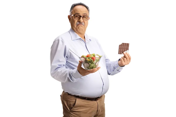 Pensive Mature Man Holding Salad Chocolate Bar Isolated White Background — Stock Photo, Image
