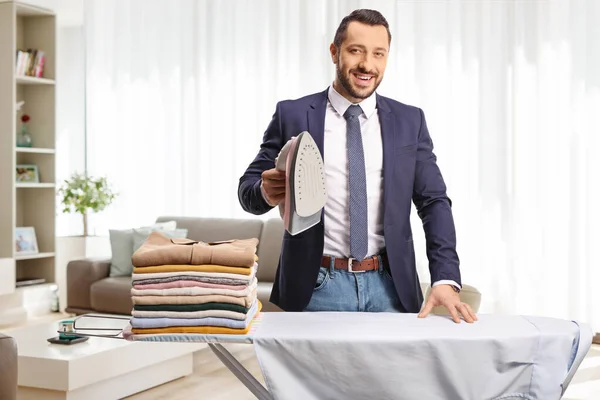 Businessman Home Pile Clothes Board Holding Iron Smiling — Stock Photo, Image