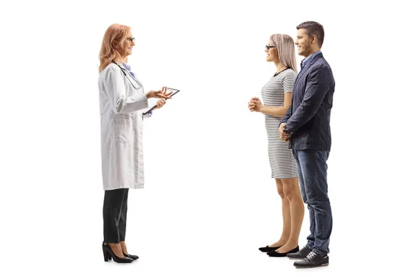 Full Length Profile Shot Female Physician Talking Young Couple Isolated — Stock Photo, Image