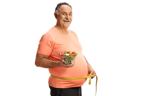 Homme Mûr Tenue Sport Tenant Une Salade Mesurant Taille Isolé — Photo