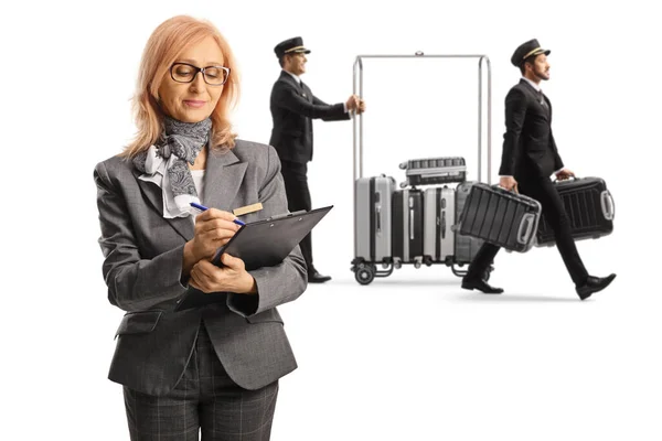 Bellboys Carrying Suitcases Luggage Cart Female Hotel Manager Writing Document — Stock Photo, Image