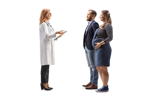 Full Length Profile Shot Young Expecting Couple Talking Female Doctor — Stock Photo, Image