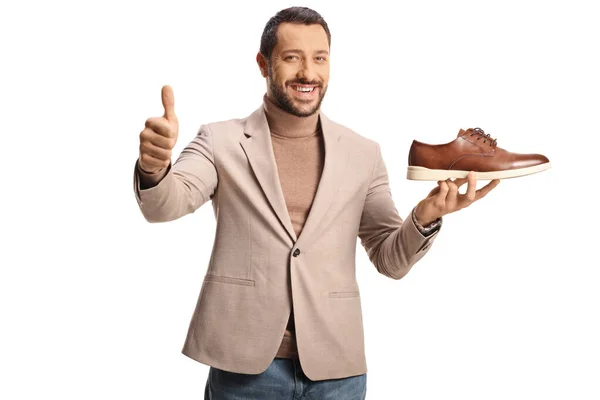 Young Man Holding Brown Leather Shoe Gesturing Thumbs Isolated White — Stock Photo, Image