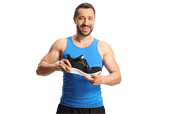 Fit Jongeman Met Een Running Sneaker Glimlachen Geïsoleerd Witte Achtergrond — Stockfoto
