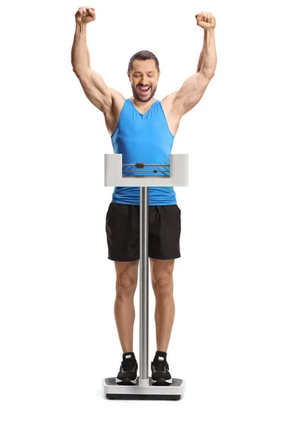 兴奋的年轻人 体重减轻到医学的高度 在白色的背景下表示幸福 — 图库照片