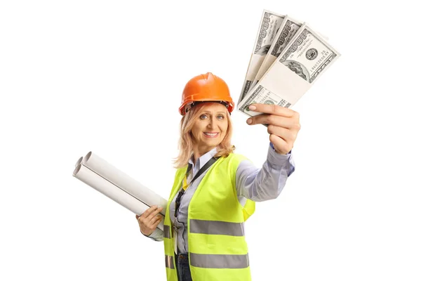 Female Engineer Safety Vest Hardhat Holding Blueprints Showing Stacks Money — Stock Photo, Image