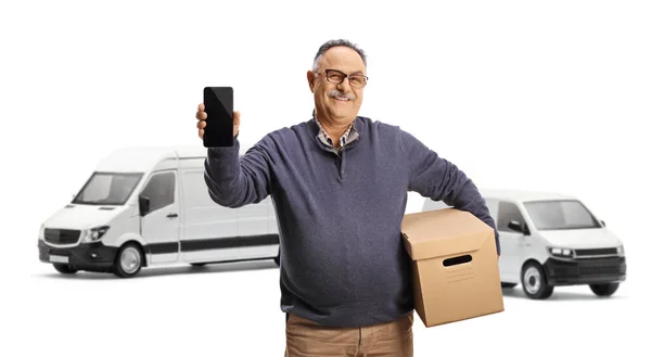 Mature Man Cardboard Box Standing Front Transport Vans Showing Smartphone — Stock Photo, Image
