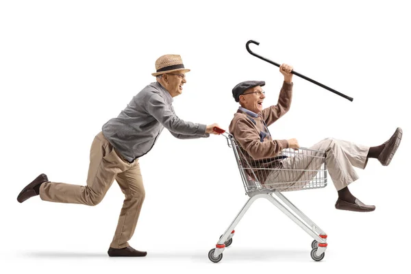 Senior Mannen Hebben Plezier Rijden Een Winkelwagen Geïsoleerd Witte Achtergrond — Stockfoto