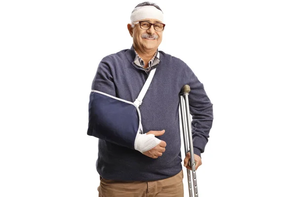 Mature Man Broken Arm Bandage Head Leaning Crutch Isolated White — Stock Photo, Image