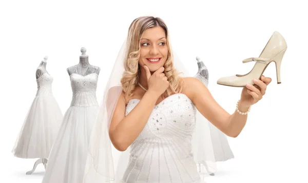新娘为婚礼选择鞋子和礼服 背景是白色的 — 图库照片