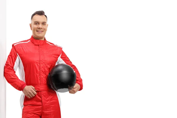 Racer Red Suit Leaning Wall Holding Black Helmet Isolated White — Stock Photo, Image