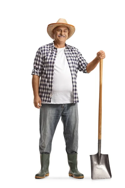 全长肖像一个快乐的成熟农民与铲子隔离的白色背景 — 图库照片