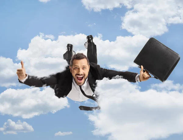 Businessman Briefcase Flying Gesturing Thumbs Sky — Stock Photo, Image