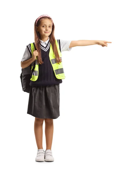 Full Length Portrait Schoolgirl Wearing Safety Vest Pointing Side Isolated — Stock Photo, Image