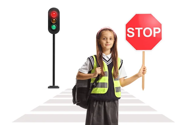 白い背景に隔離された通りで停止信号を保持している安全ベストの女の子 — ストック写真