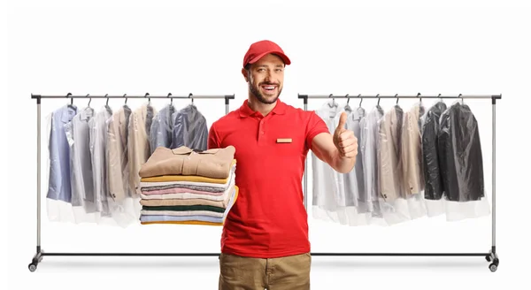 Laundry Worker Holding Pile Folded Clothes Gesturing Thumbs Front Clothing — Stock Photo, Image