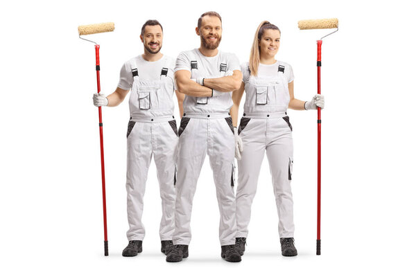 Male and female house painters in white overall pants smiling at camera isolated on white background