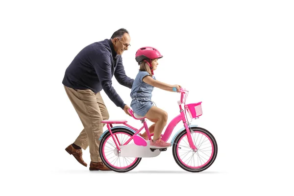 Perfil Avô Ajudando Uma Menina Montando Uma Bicicleta Isolada Fundo — Fotografia de Stock